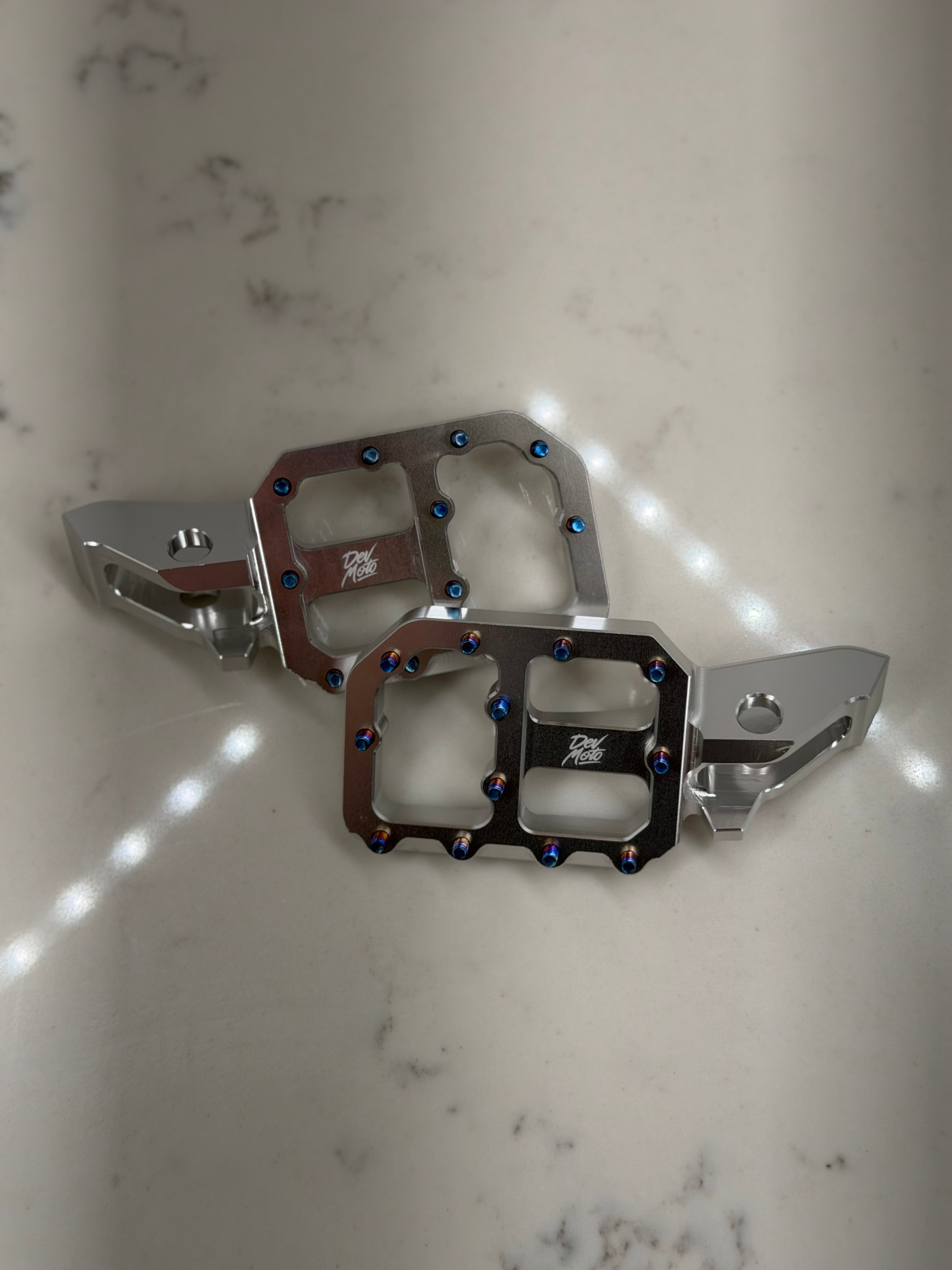 Silver CNC e-moto foot pegs