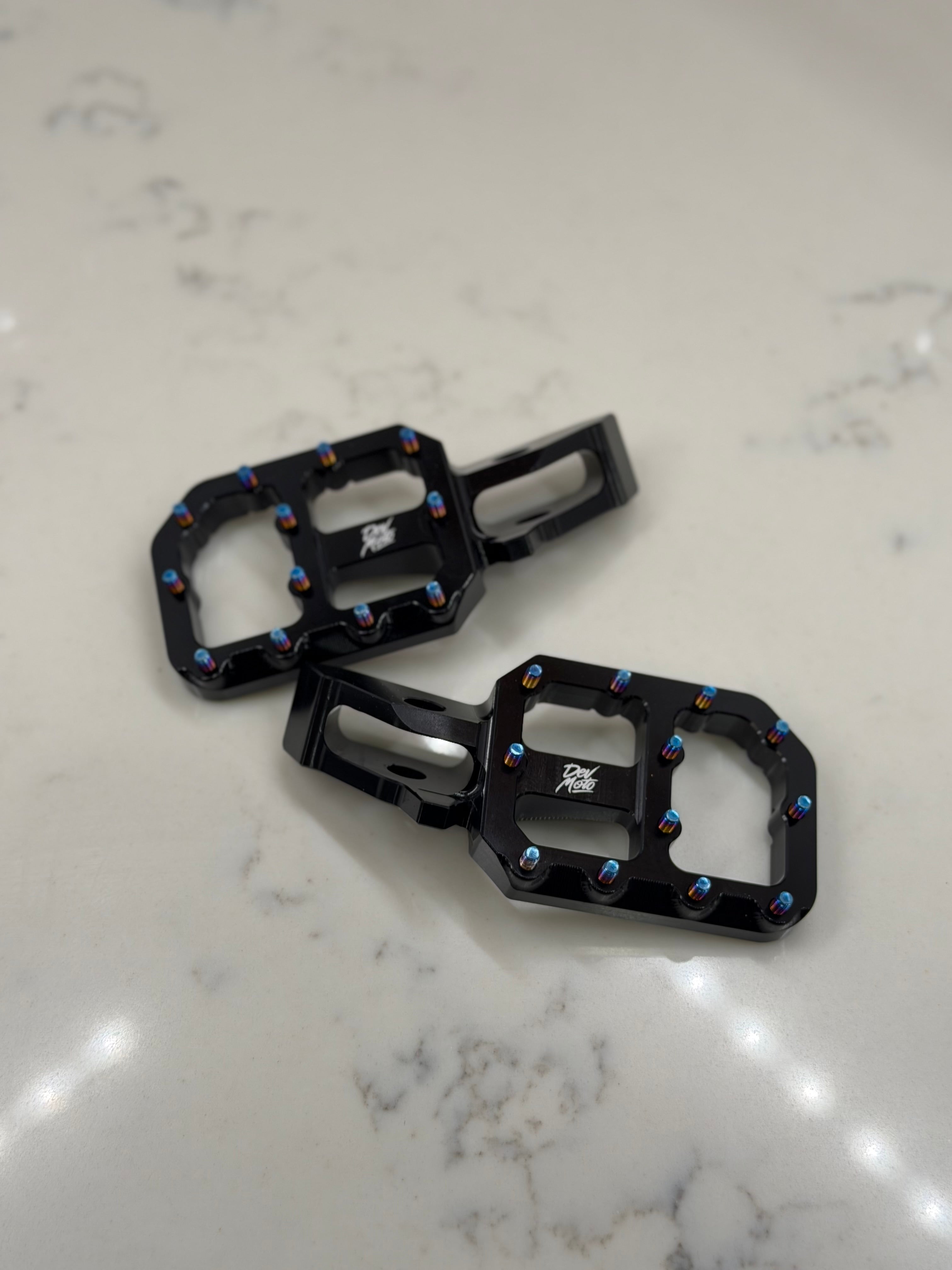 Black CNC e-moto foot pegs