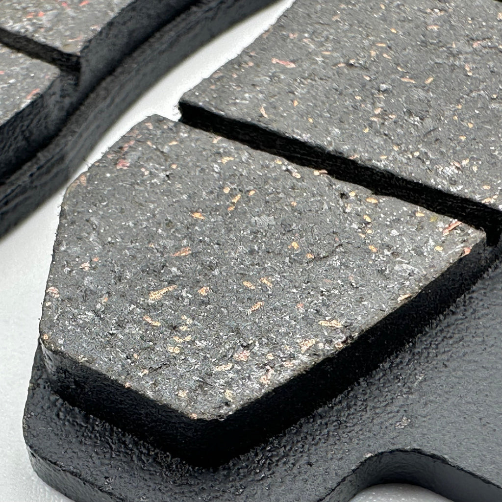 Close-up of Sur-Ron Ultra Bee replacement brake pads