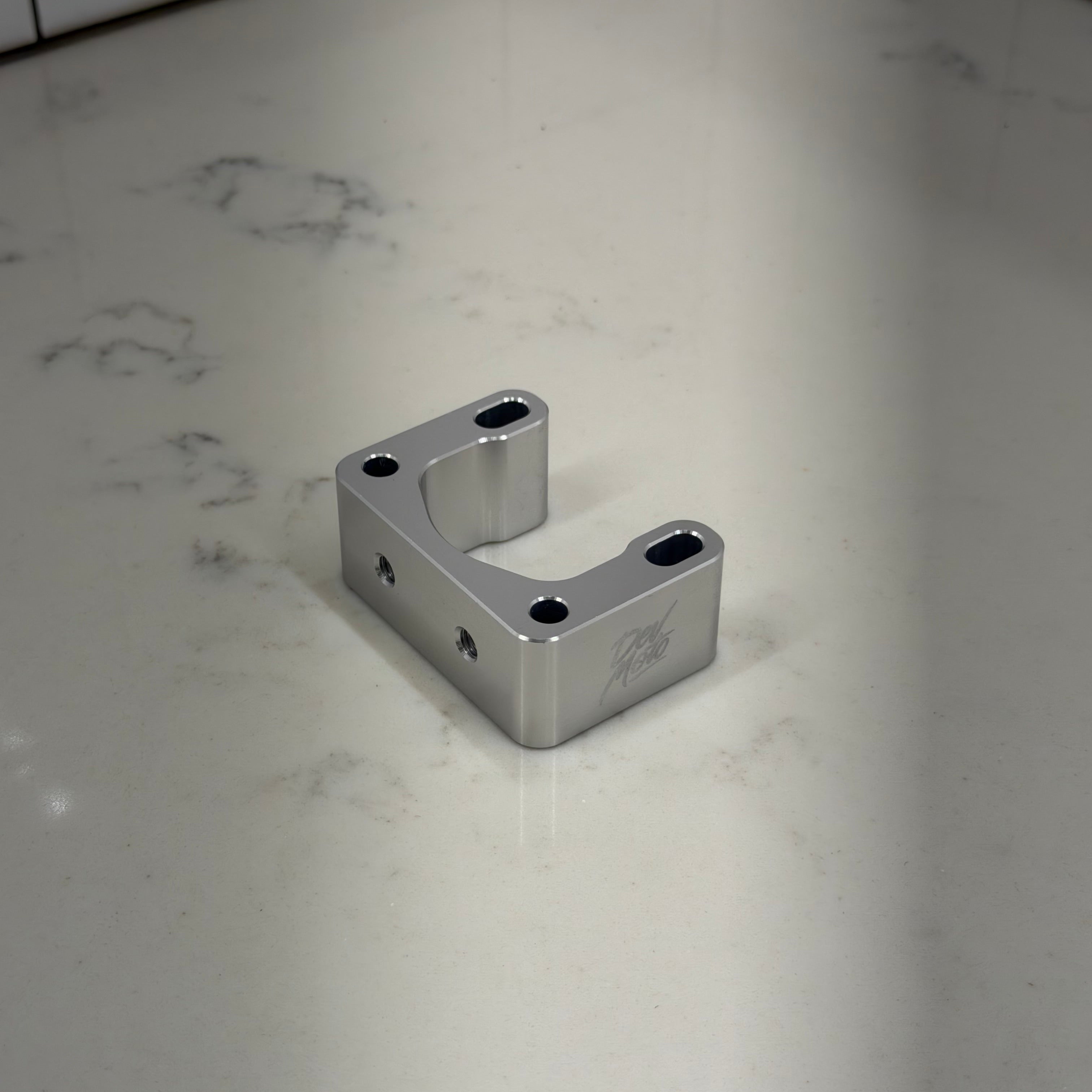 E-moto handlebar riser finish and mounting detail