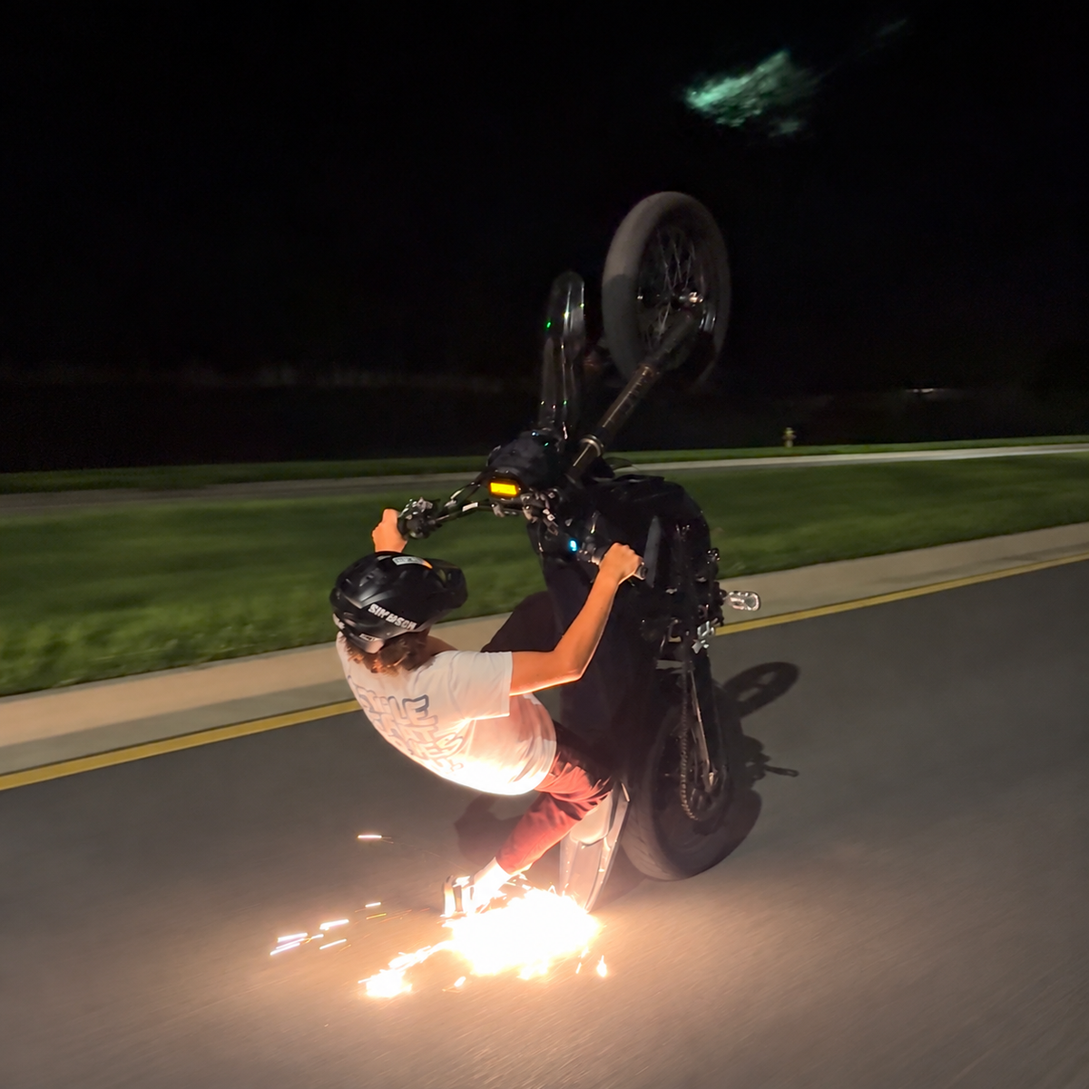 E-Moto Rear Fender Scrape Kit installed on e-moto at night
