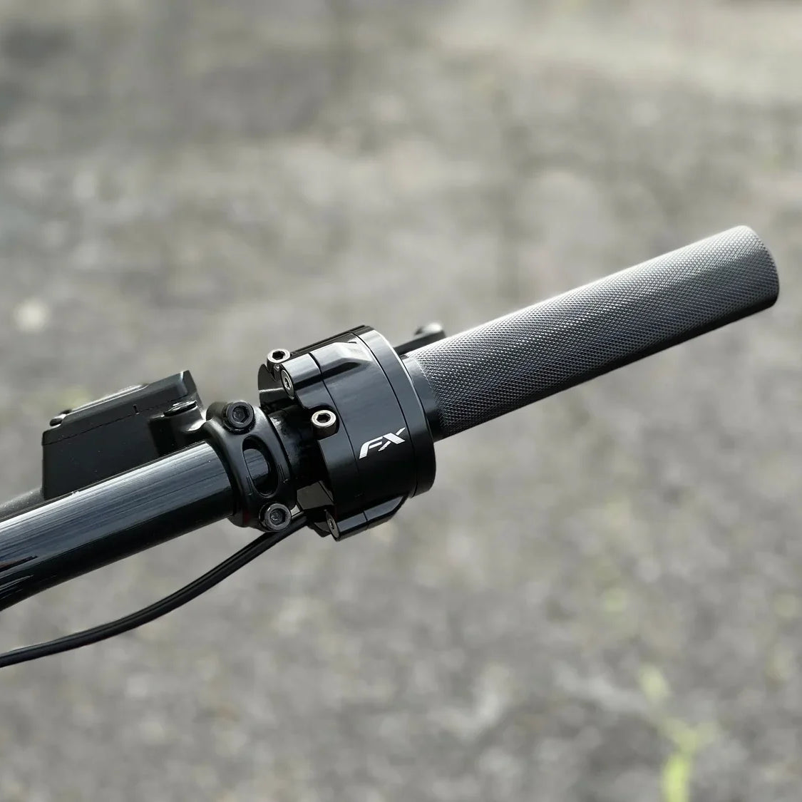 FX twist throttle installed on e-moto handlebars